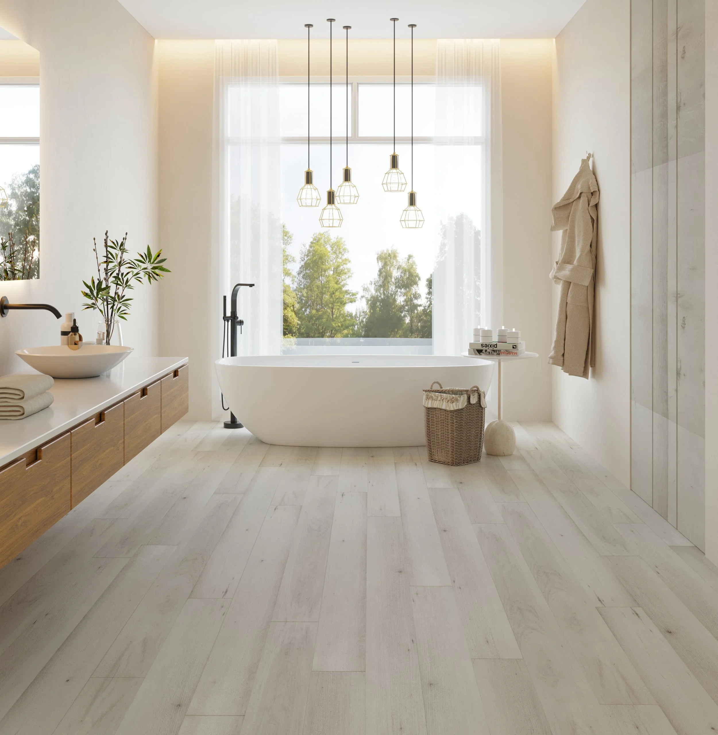 A modern bathroom with a freestanding bathtub placed in front of a large window, white walls, and a wooden vanity with neatly folded towels and a plant on top. Over the bathtub hangs a cluster of five geometric pendant lights.