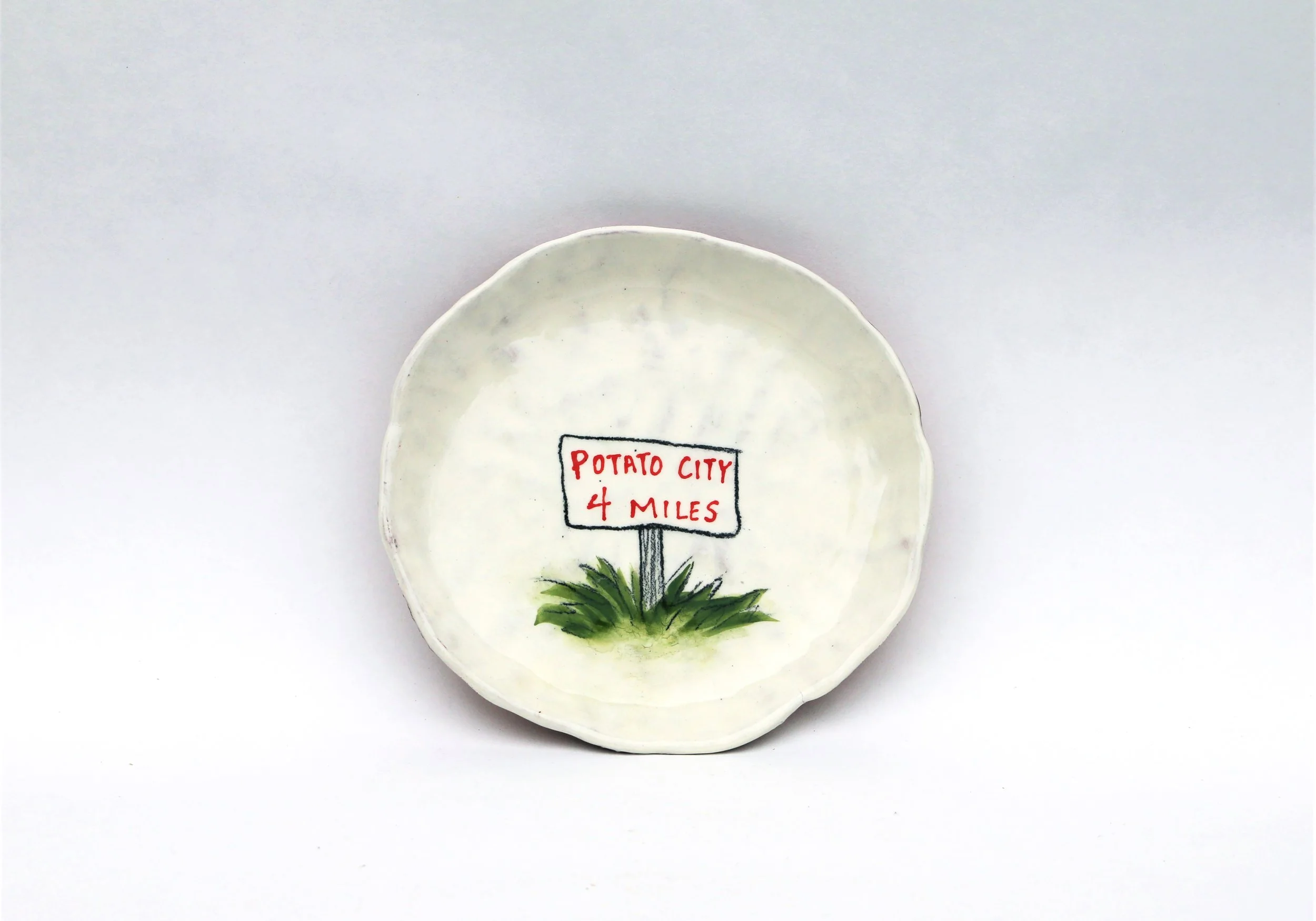 Potato City, 2021, 6.5 x 6.5 x 0.5 inches, earthenware