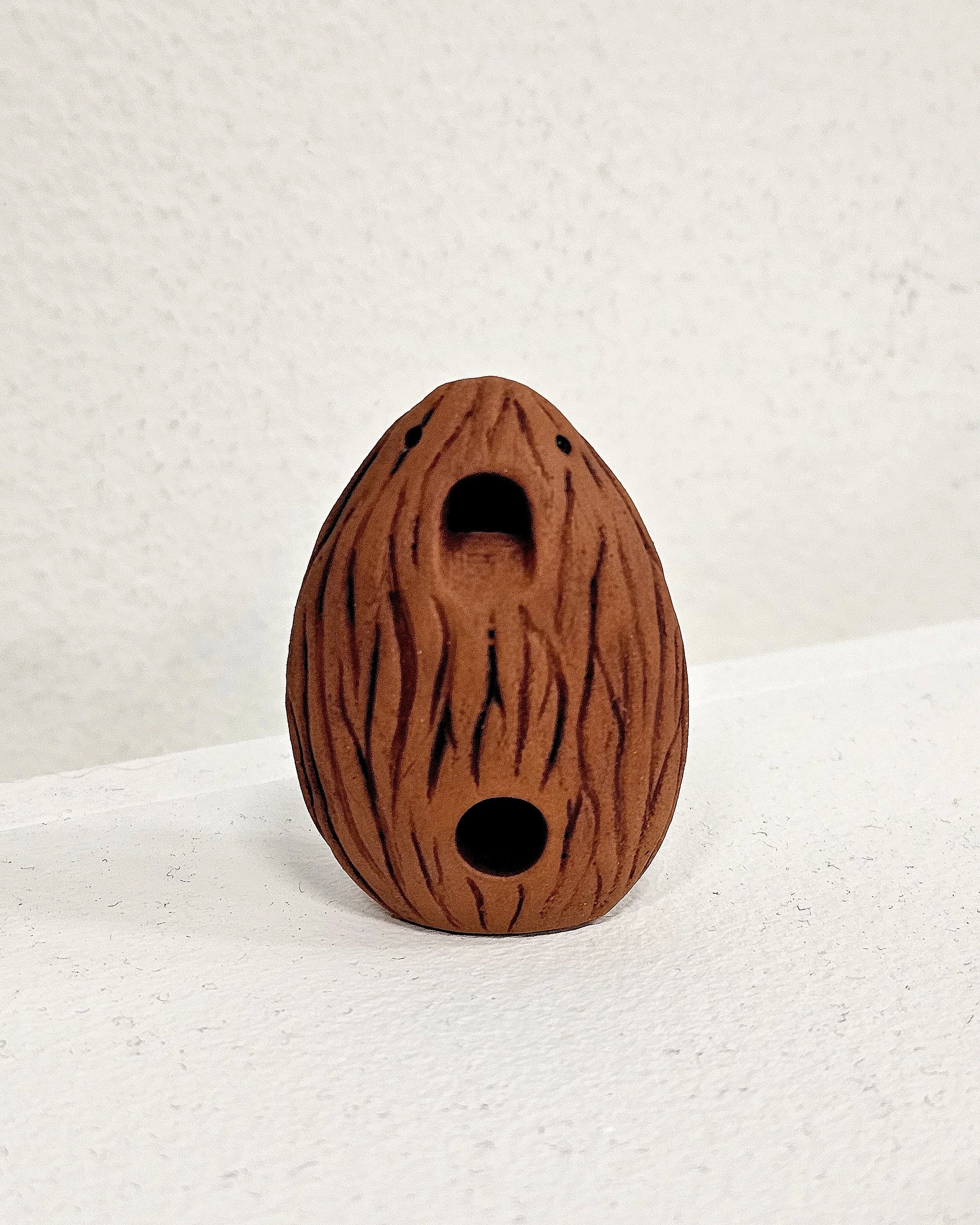 Activated Almond, 2025, 2 x 1 x 0.75 inches, earthenware, electric-fired, cone 02

(An activated almond whistle to activate other almonds.)