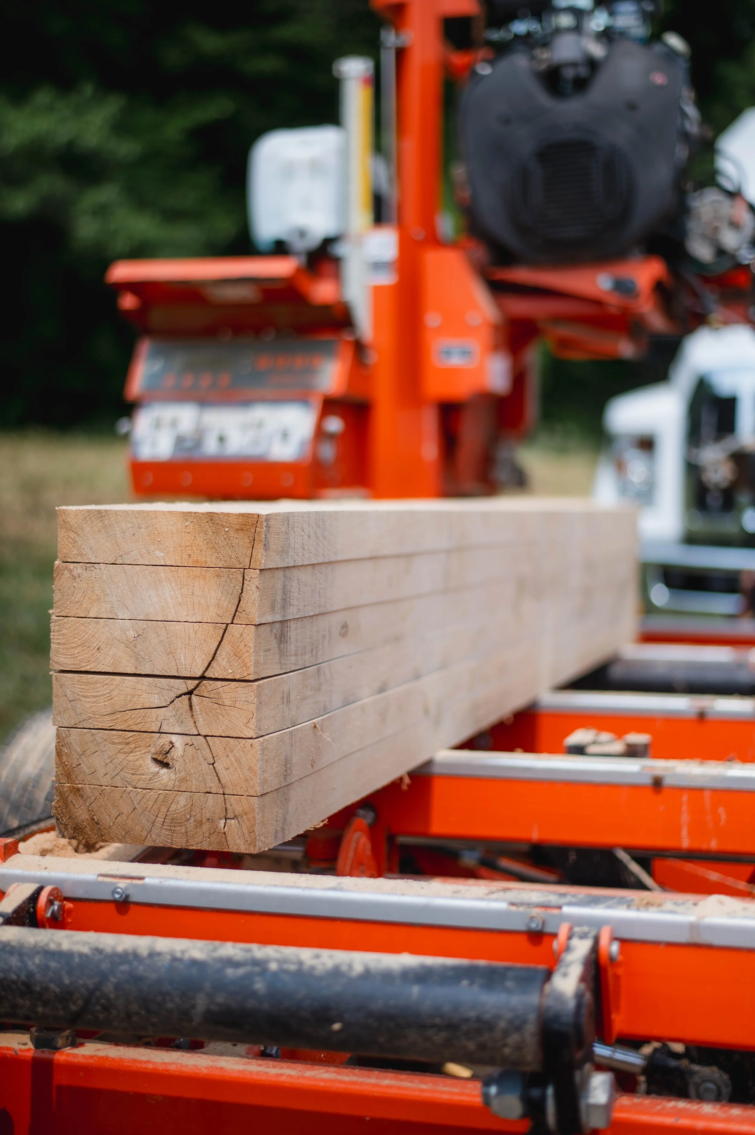 Neatly stacked lumber on an orange wood mill
