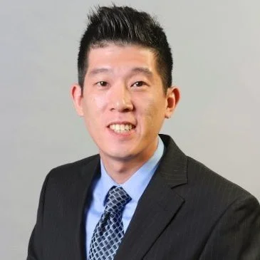 Professional man in a suit and tie smiling at the camera