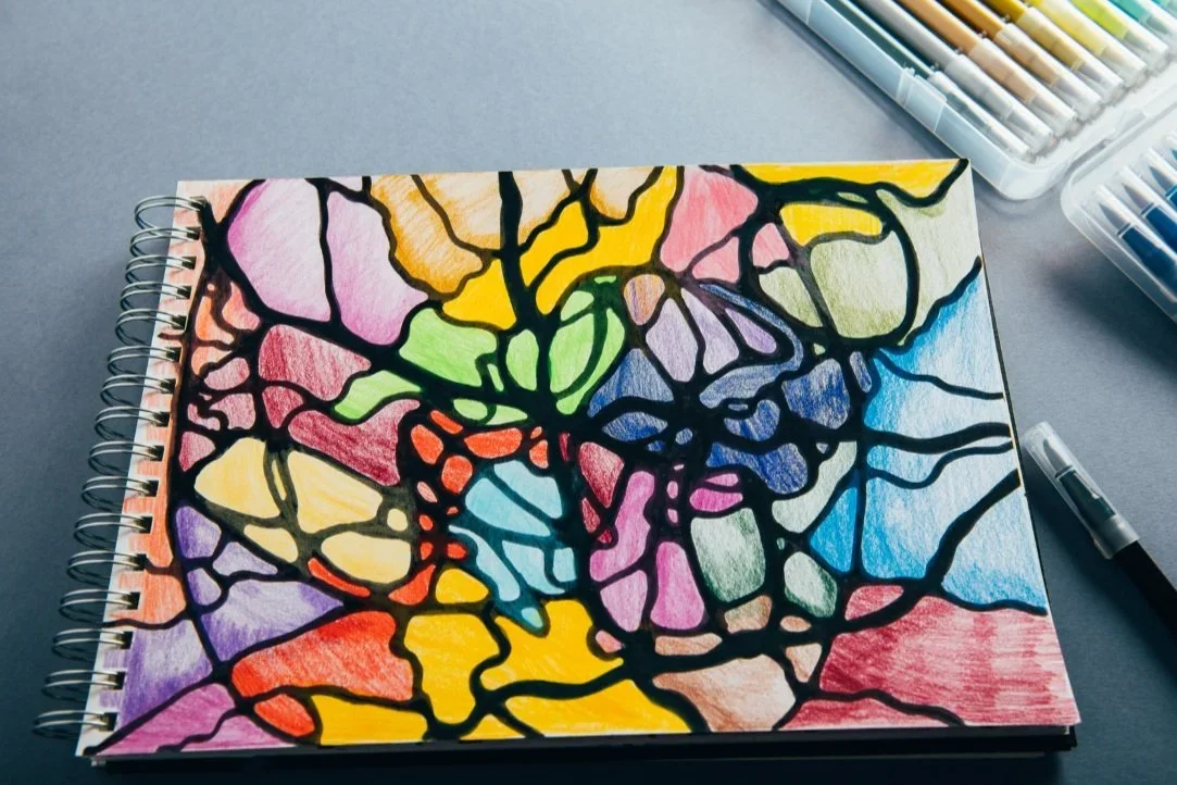 Sketchbook with scribble drawing created during art therapy session.