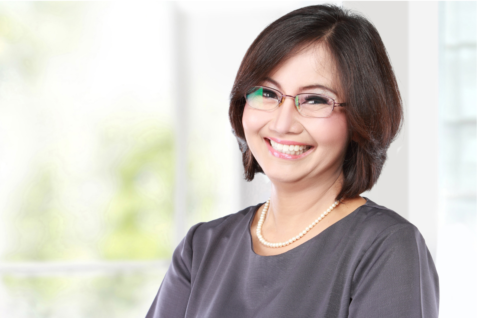 Woman smiling after therapy with Amanda Metropolus, ATR, LPC.