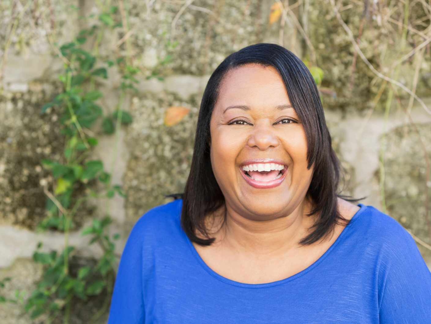 Woman smiling in while investing in therapy with Fresh Therapy LLC in Milwaukee, WI.
