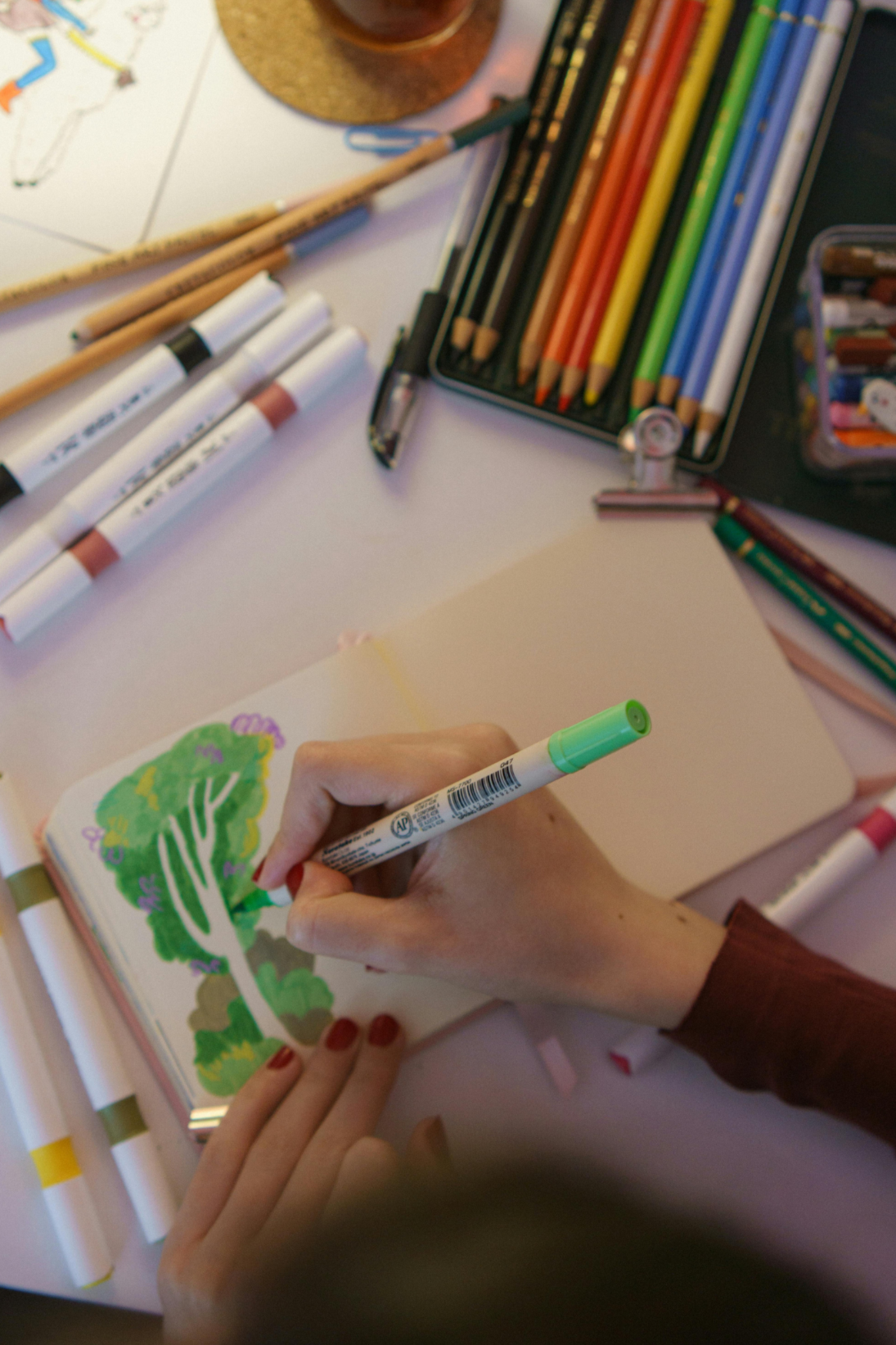 Creating a tree image with markers in art therapy with Fresh Therapy LLC.