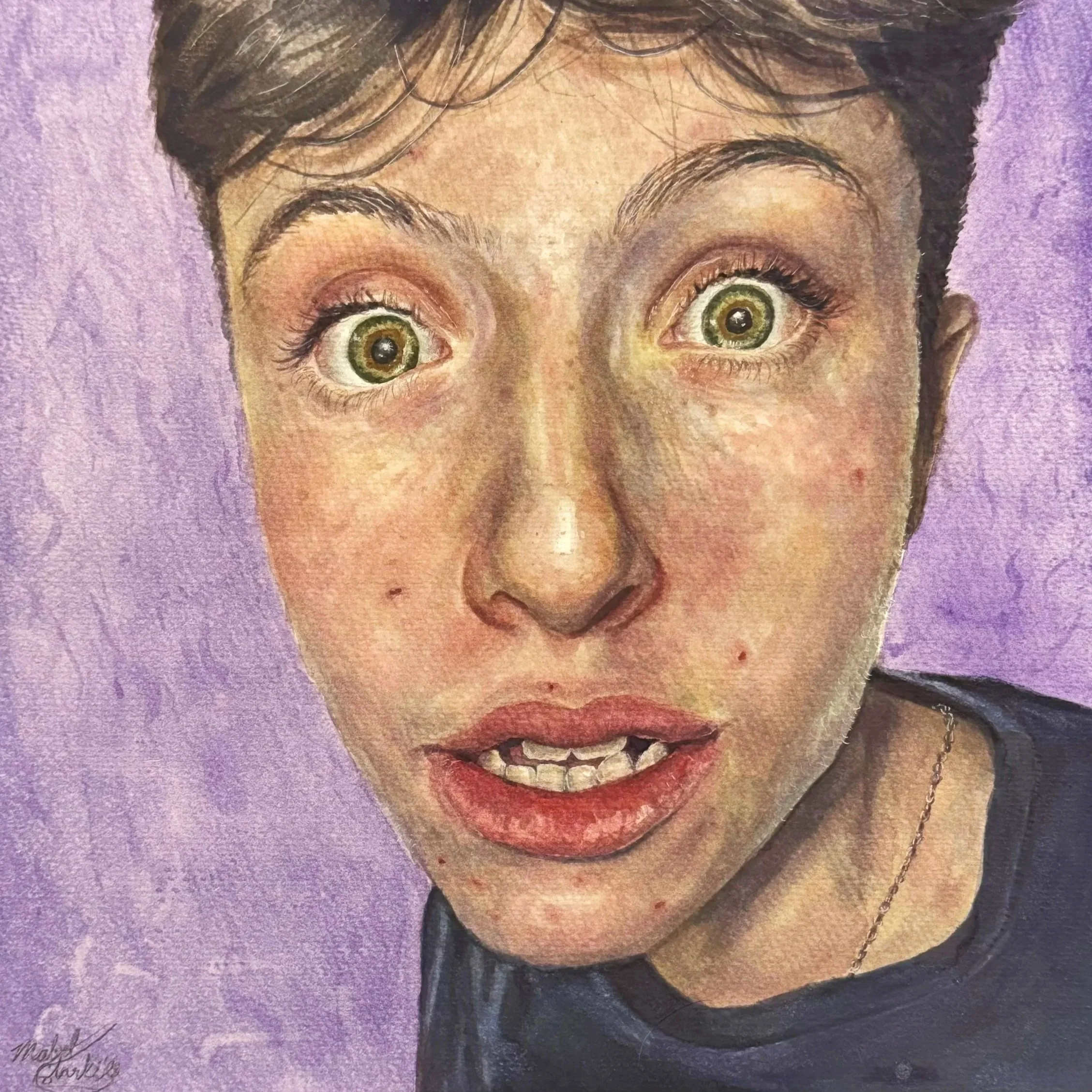 Close-up portrait of a person with short dark hair, big expressive green eyes, and an open mouth showing uneven teeth, set against a purple background.