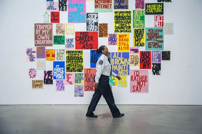 Guard walks by signs