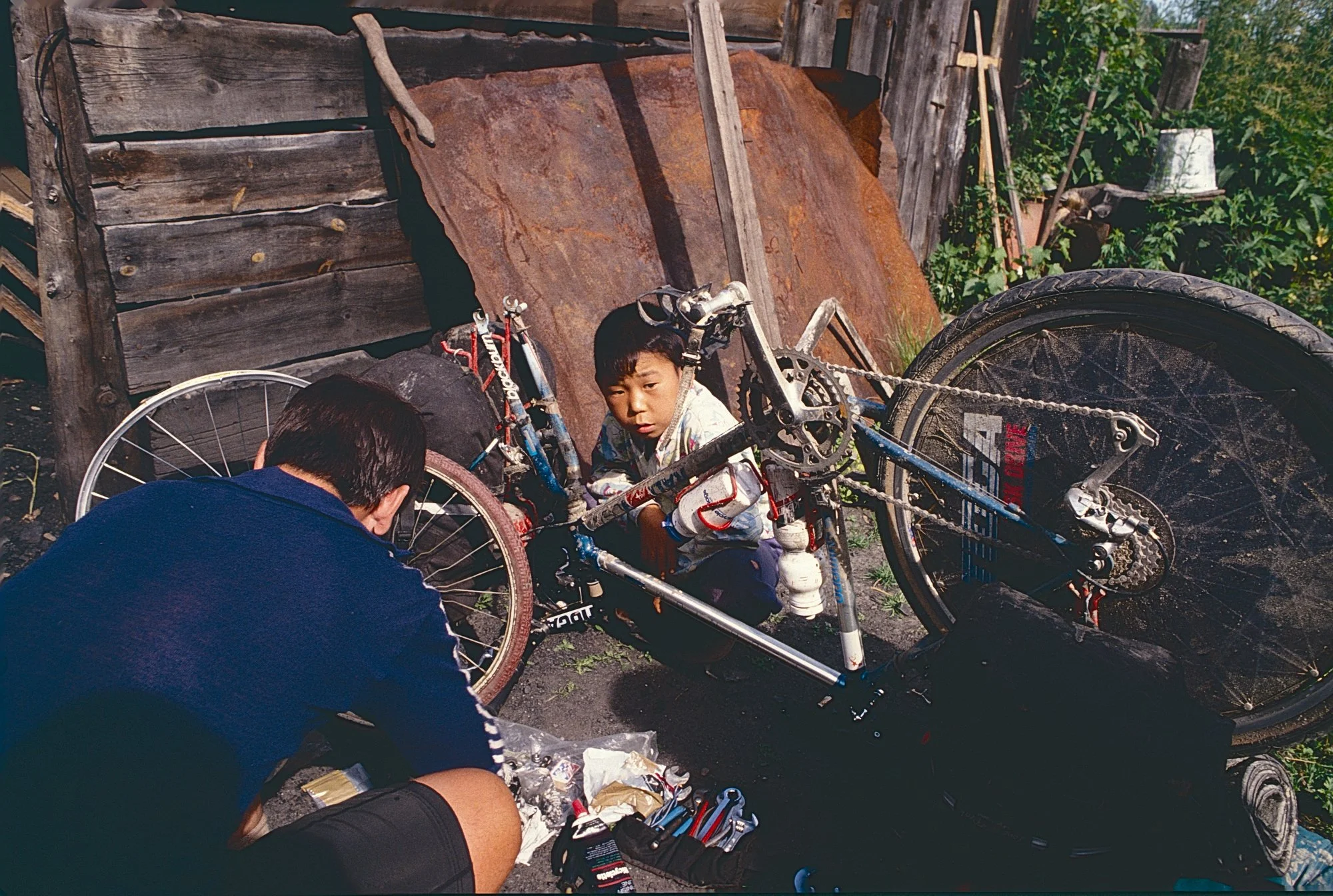 There, the head the Communist party shows an unusual Soviet trait (perhaps less surprising in the remote Altai): initiative. He summons a front wheel from a local kid's bike (sorry, kid), and we manage to  "secure" it to the fork. 