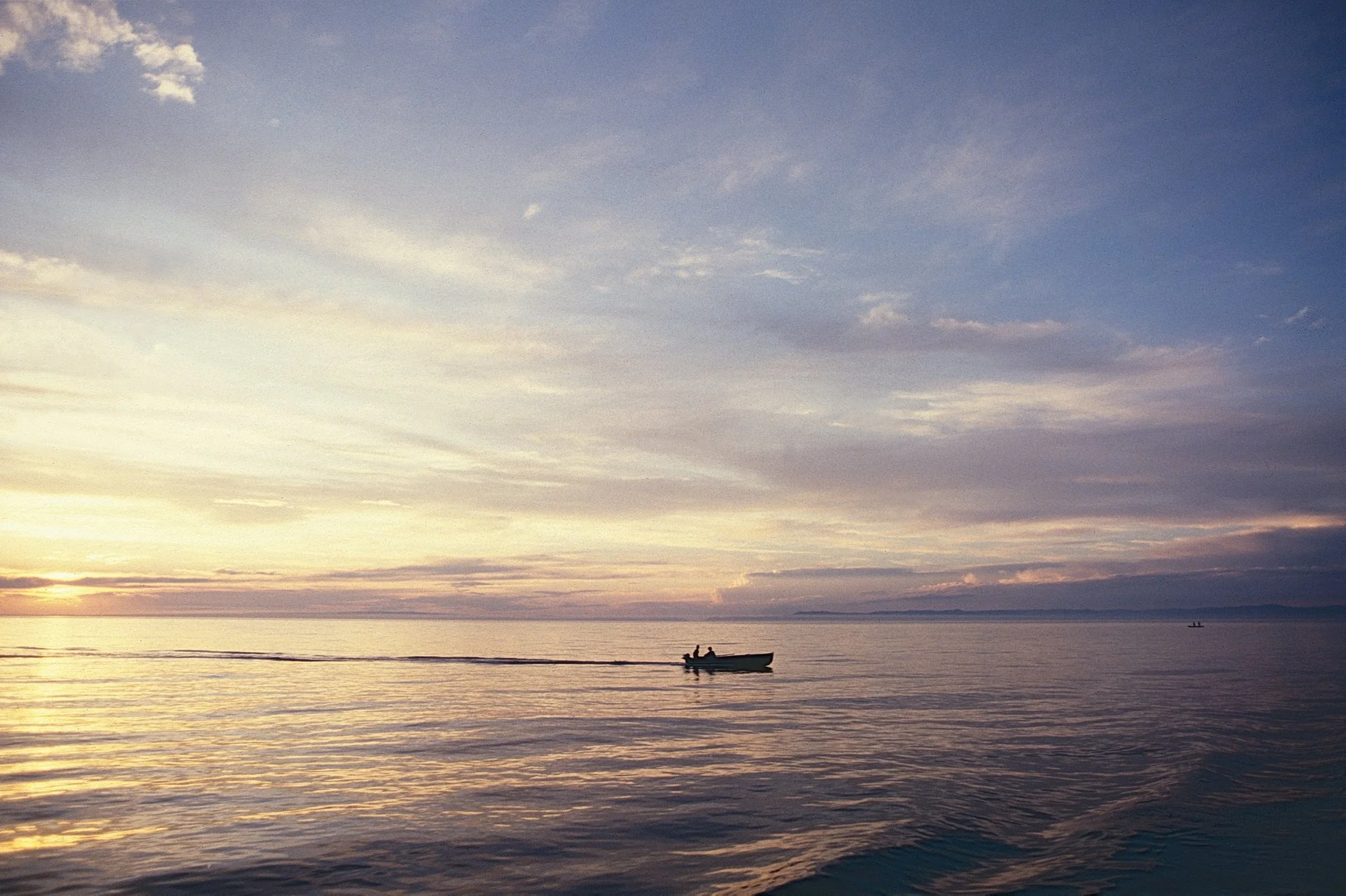 The sun sets on the world's largest and deepest body of fresh water. We spent a few days resting in Irkutsk, on Lake Baïkal's shores, before heading east the toward the swamp, the toughest part of the trip.