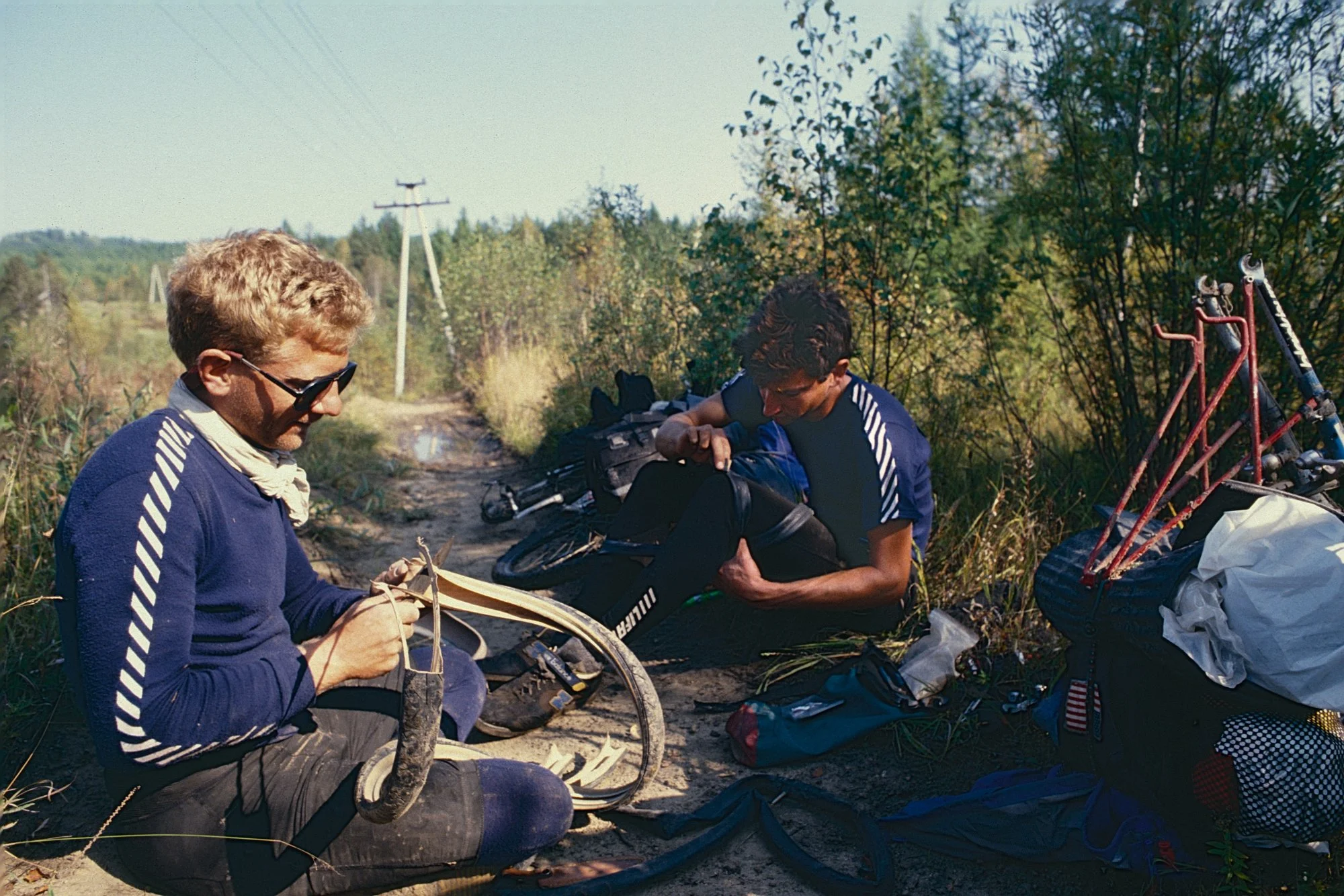 No progress. After spending the night in a settlement alongside the Trans-Siberian tracks, we head out early, blow a few sidewalls, and snap a pannier rack trying to ride the rails -a questionable idea, but the thought of doubling our 3 km/h walking 