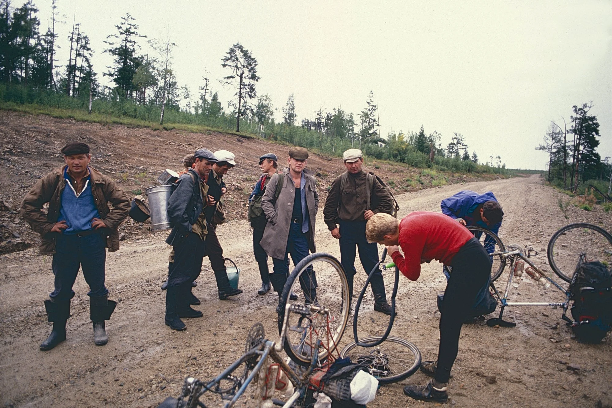 Blown sidewalls and intrigued mushroom pickers on our Siberian dirt highway.