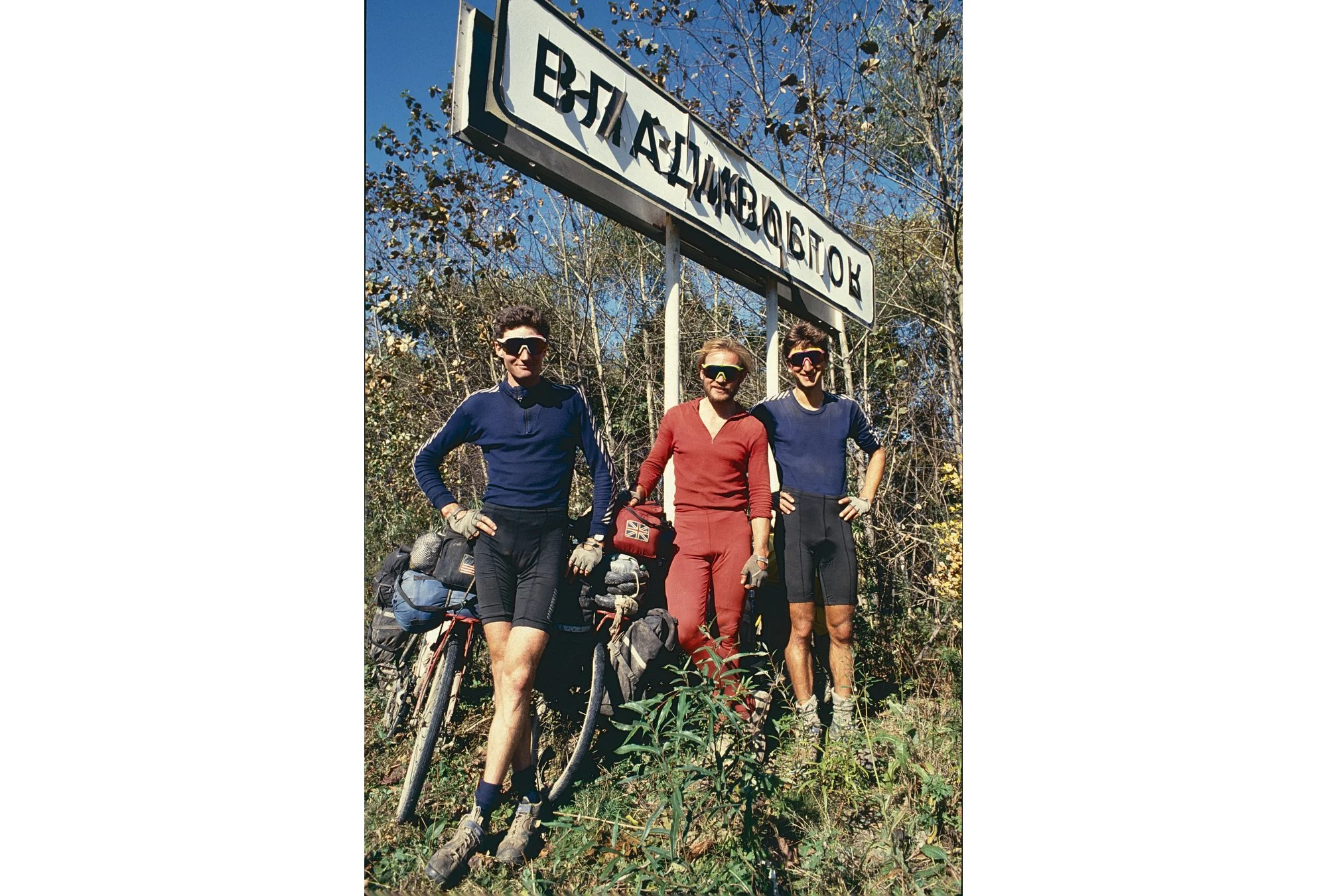 Smelling the barn as we pose under a Vladivostok sign. 