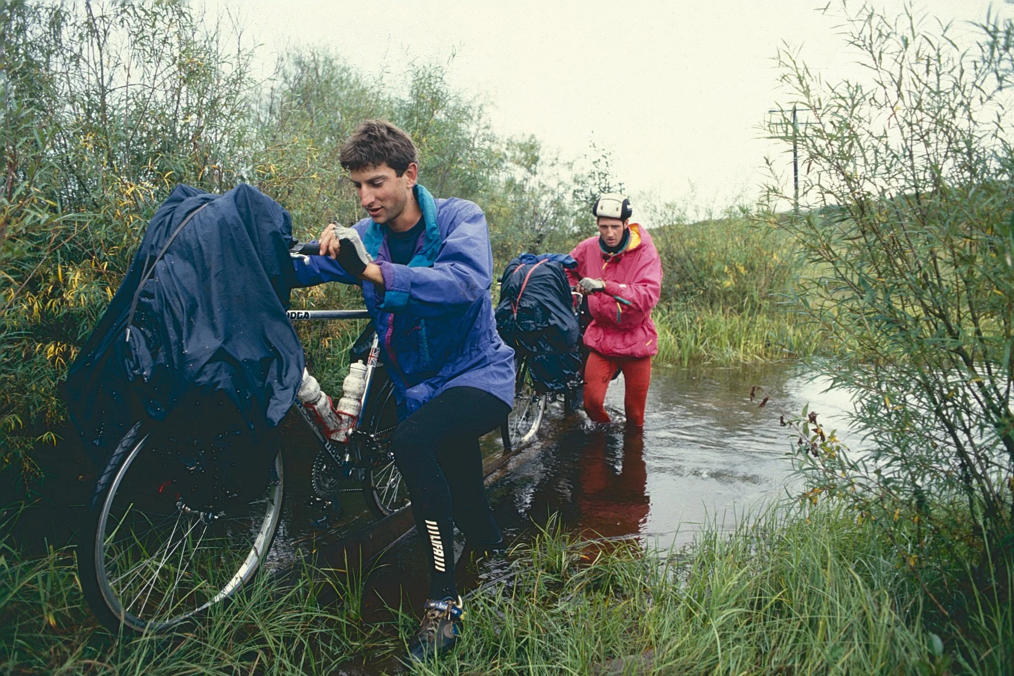 Siberian bike wash: wet and cold shoes for the rest of day, but our chains and derailleurs get a welcomes cleaning. 