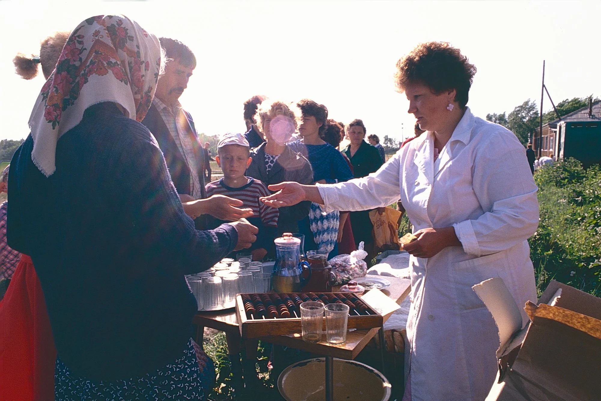 Kvas line in a Russian village. A fermented drink, Kvas was the Soviet Coca-cola and drew crowds whenever it appeared.