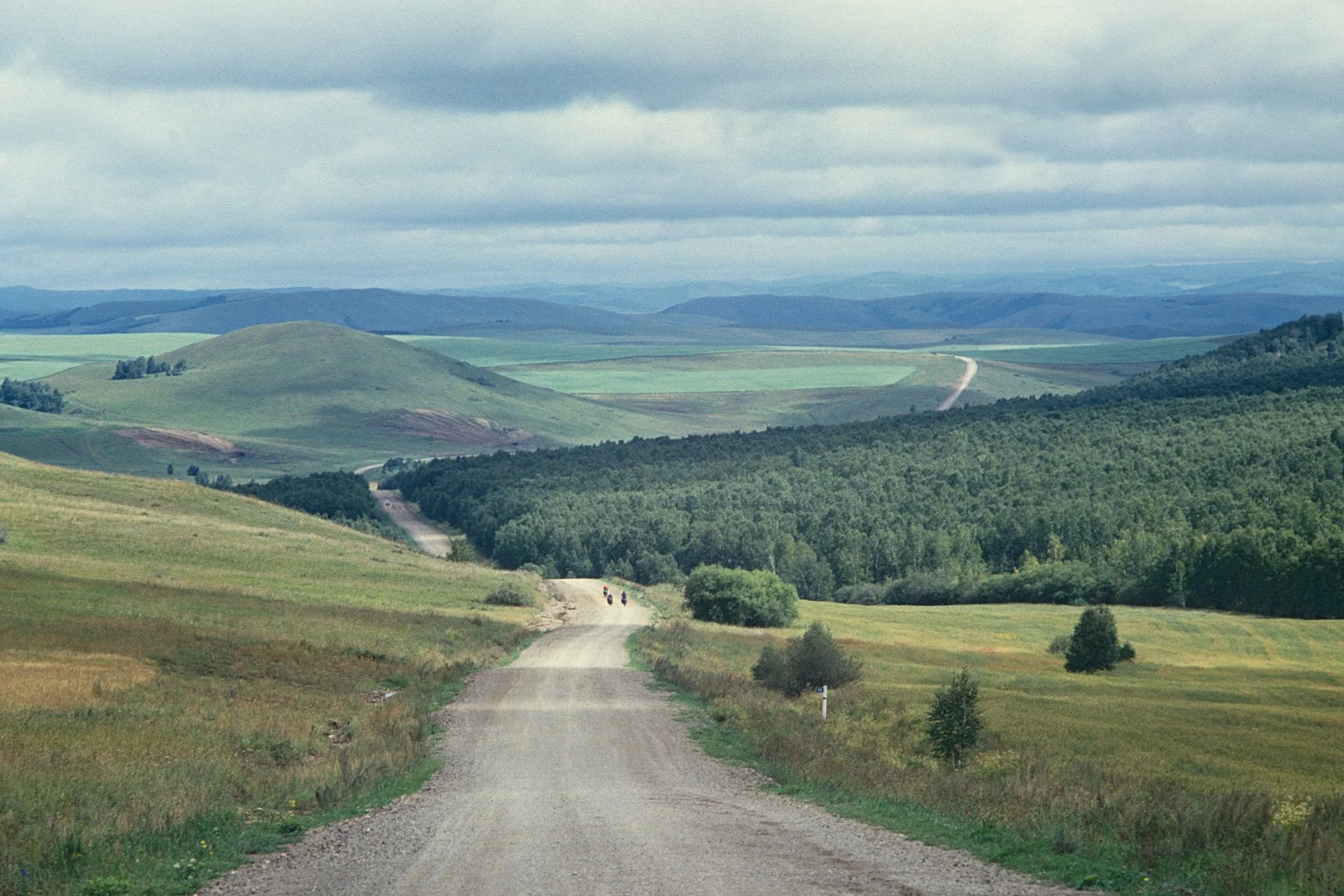 Enjoying the descent: the paved road comes to an end, but this section between Irkutsk and Chita offers decent dirt roads and a preview of Siberia's vast landscapes. 