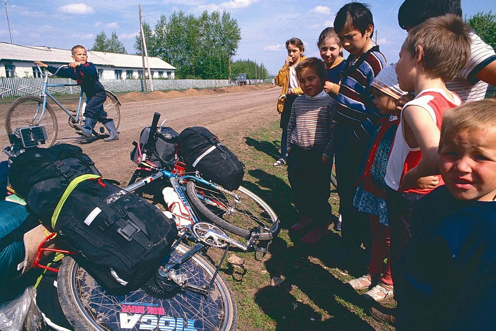 Locals kids keep us company during a stop.