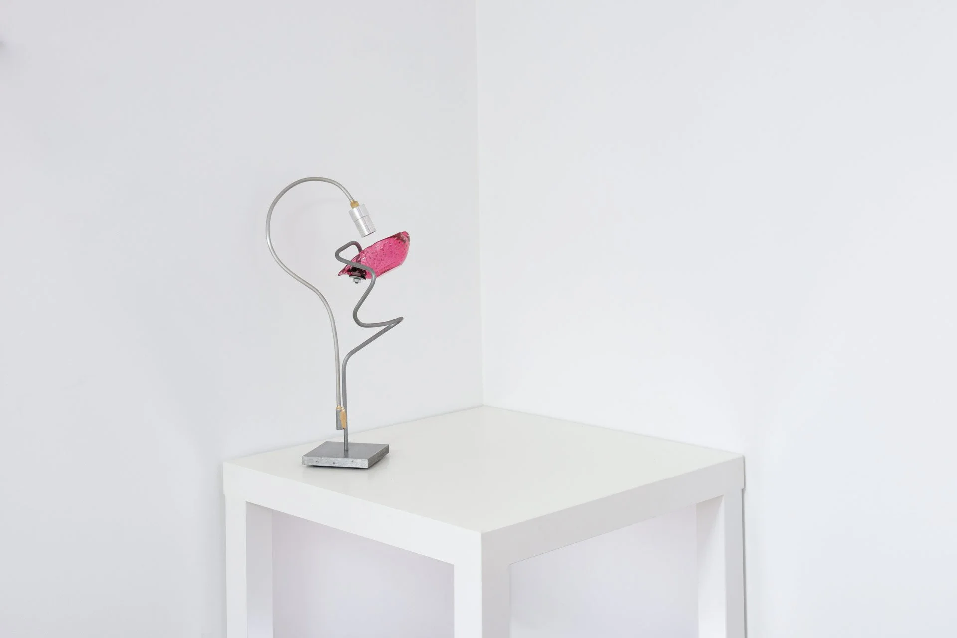 Unilluminated, wider view of the lamp.