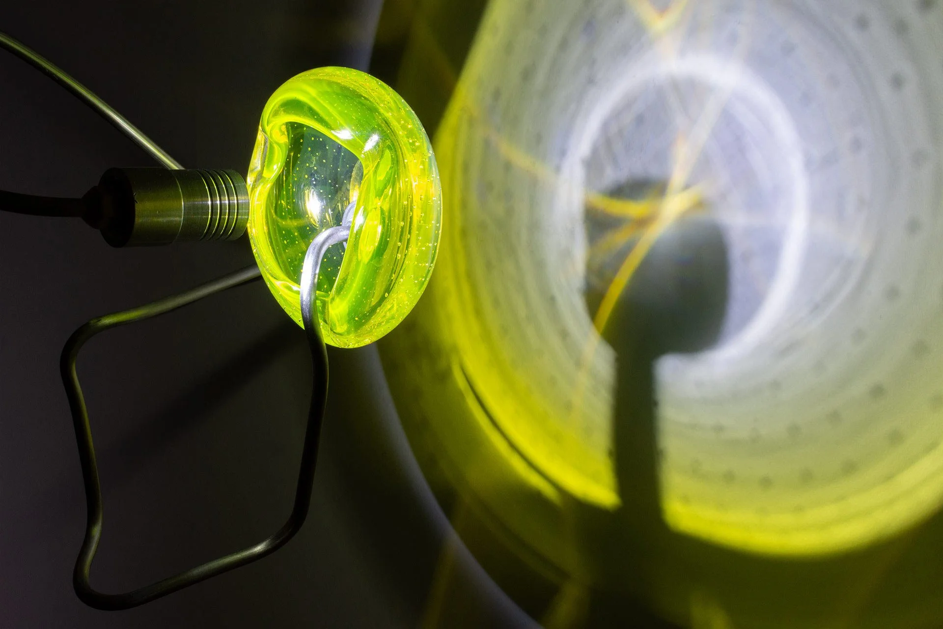 Illuminated detail shot of the ashtray, highlighting the quality of the glass that leads to a unique light cast.