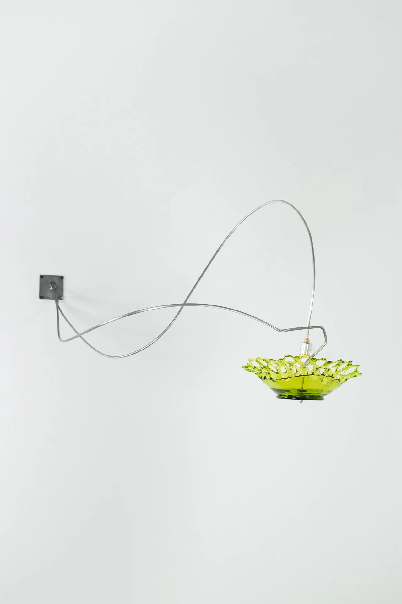 Unilluminated, the green bowl with a lace edge is emphasized.