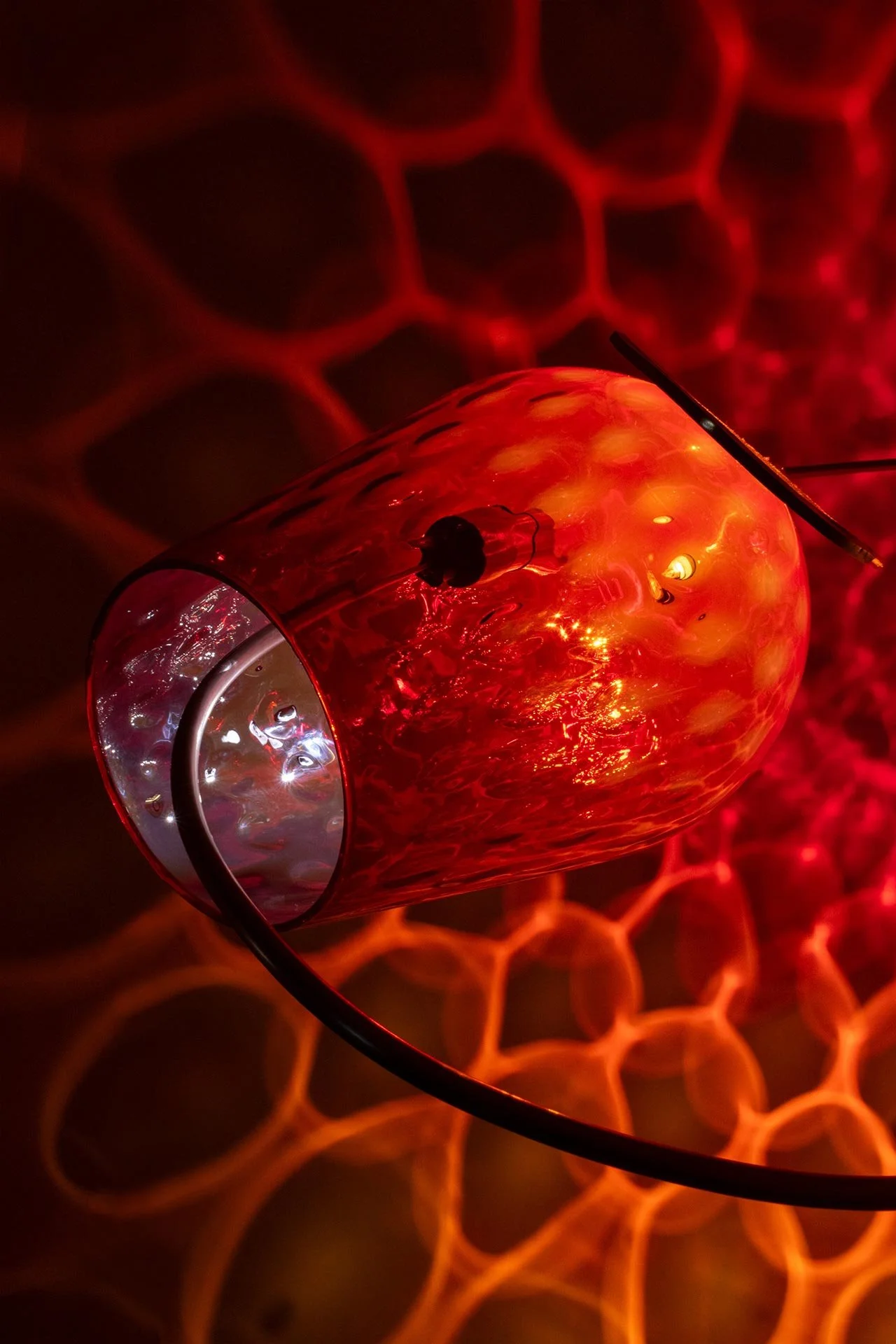 Illuminated detail shot of the vase, highlighting the quality of the glass that leads to a unique light cast.