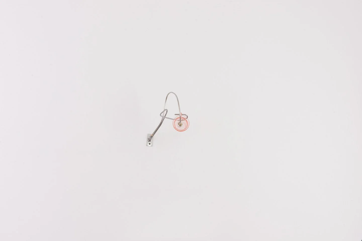 Unilluminated, the pink swirled depression glass tea cup is emphasized.