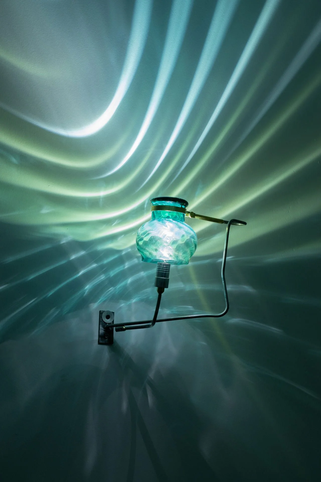 Illuminated detail shot of the vase, highlighting the quality of the glass that leads to a unique light cast.