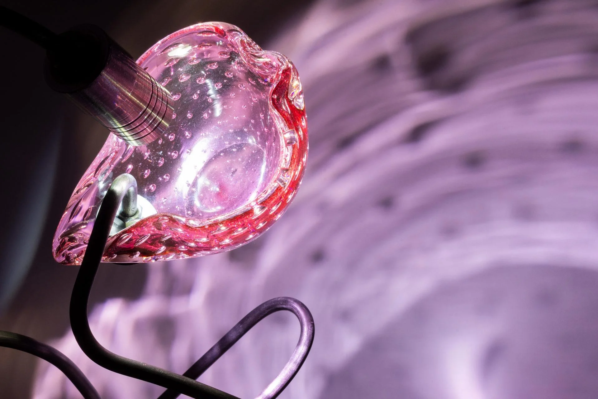 Illuminated detail shot of the ashtray, highlighting the quality of the glass that leads to a unique light cast.