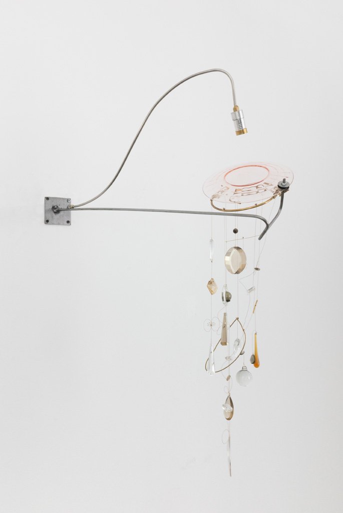 Unilluminated, the pink depression plate and crystals in off-white hues are emphasized.