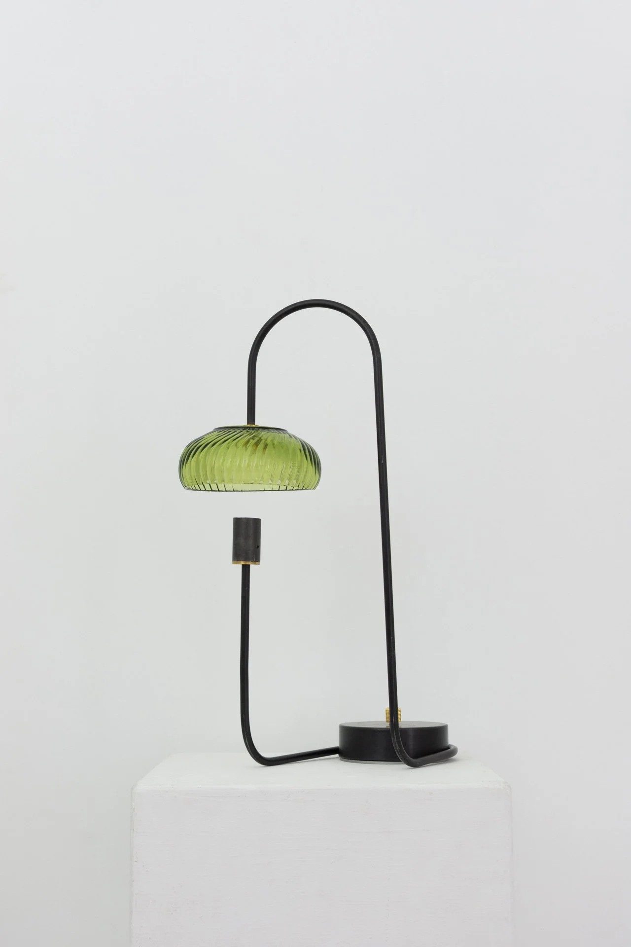 Unilluminated, wider view of the lamp.