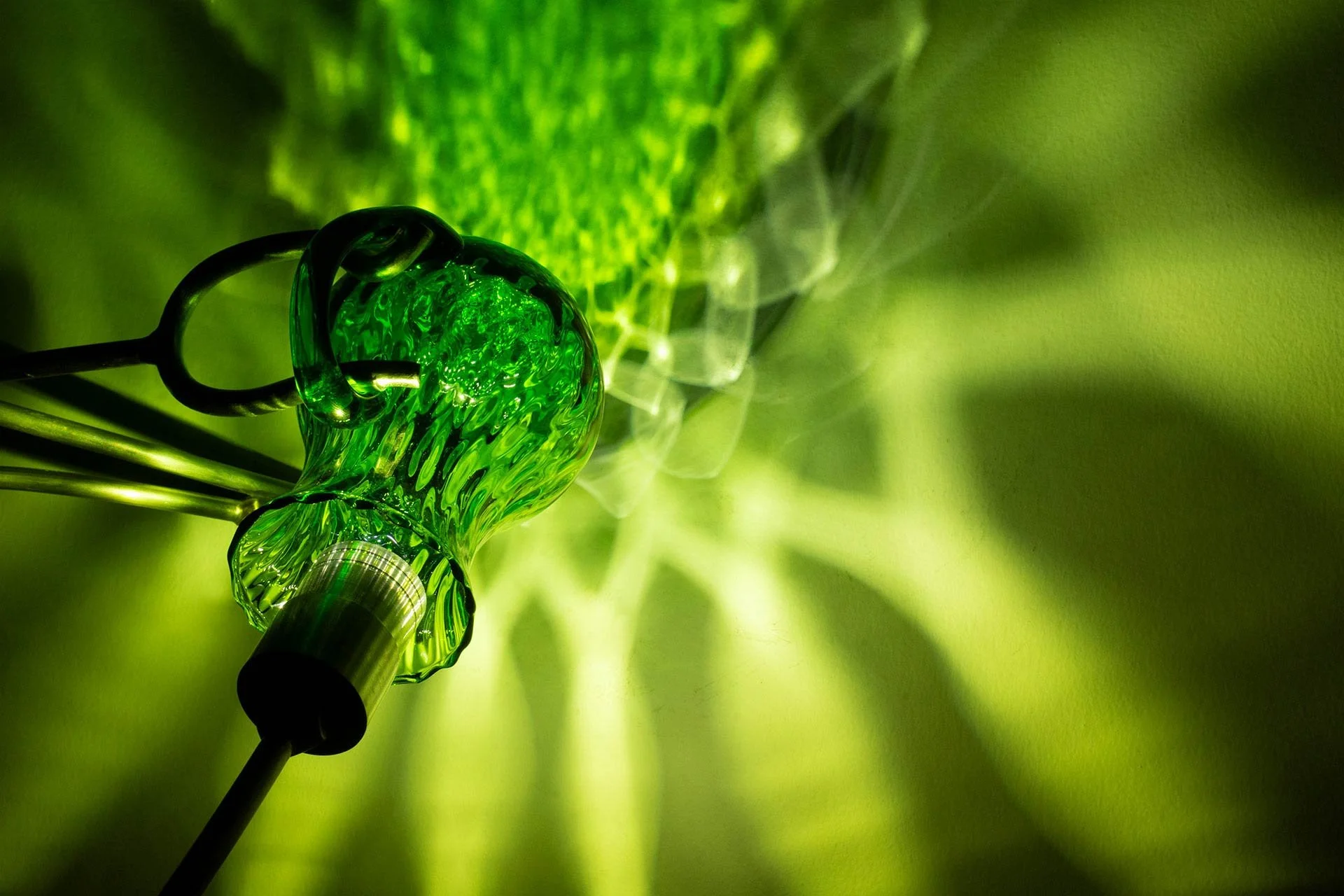 Illuminated detail shot of the pitcher, highlighting the quality of the glass that leads to a unique light cast.
