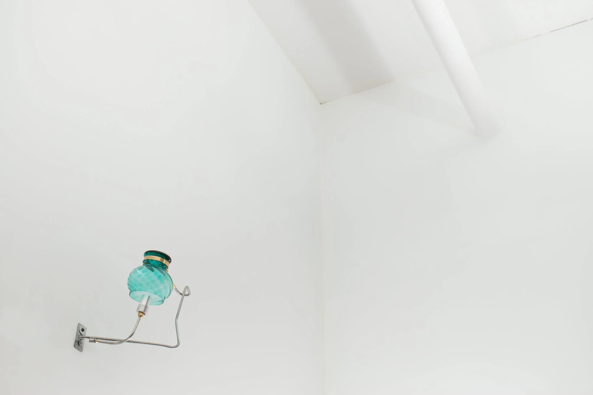 Unilluminated, the blue swirled vase is emphasized.