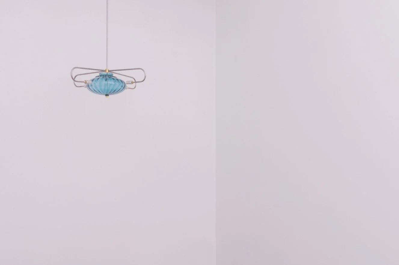 Unilluminated, wider view of the fixture.