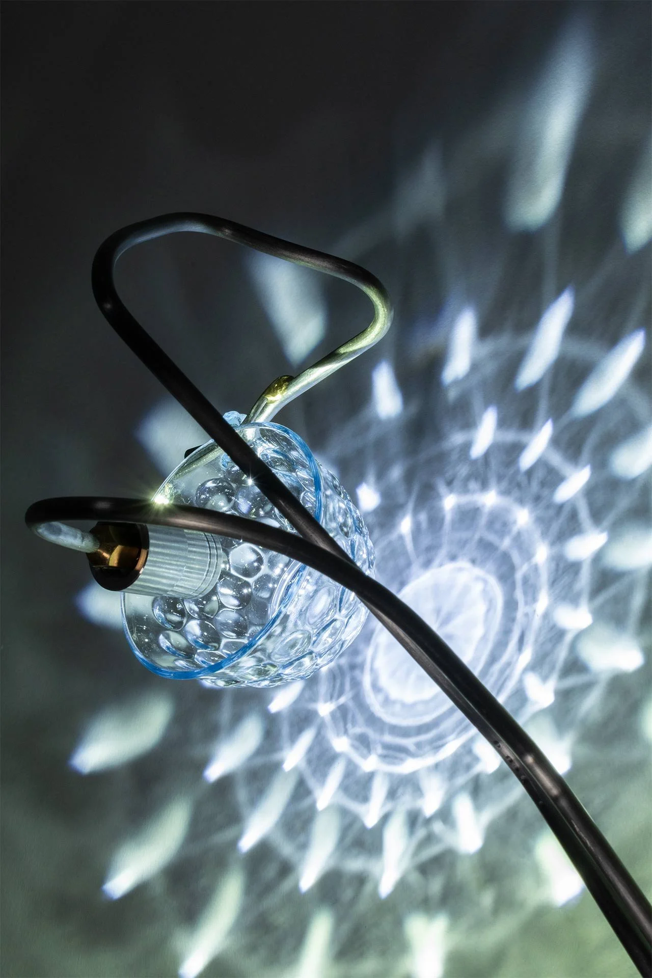 Illuminated detail shot of the tea cup, highlighting the quality of the glass that leads to a unique light cast.