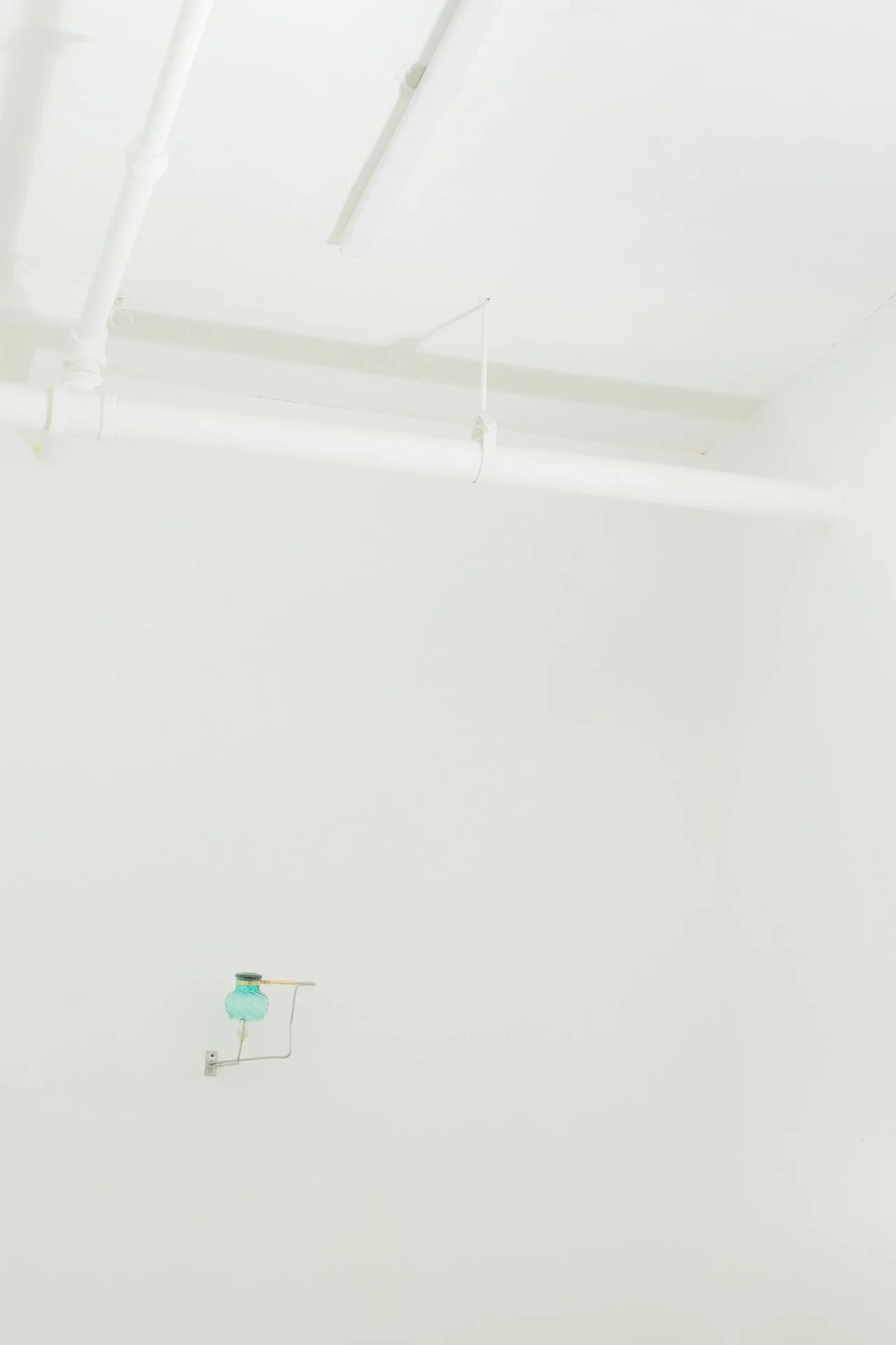 Unilluminated, wider view of the fixture.