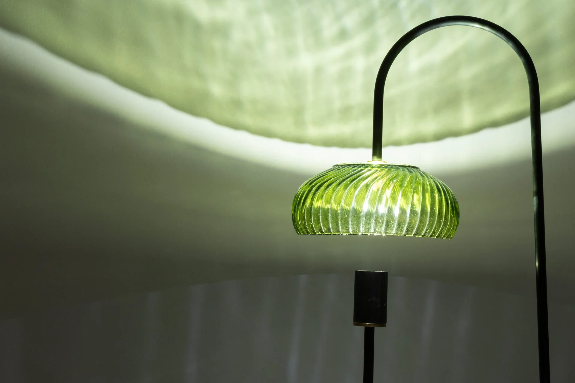 Illuminated detail shot of the bowl, highlighting the quality of the glass that leads to a unique light cast.