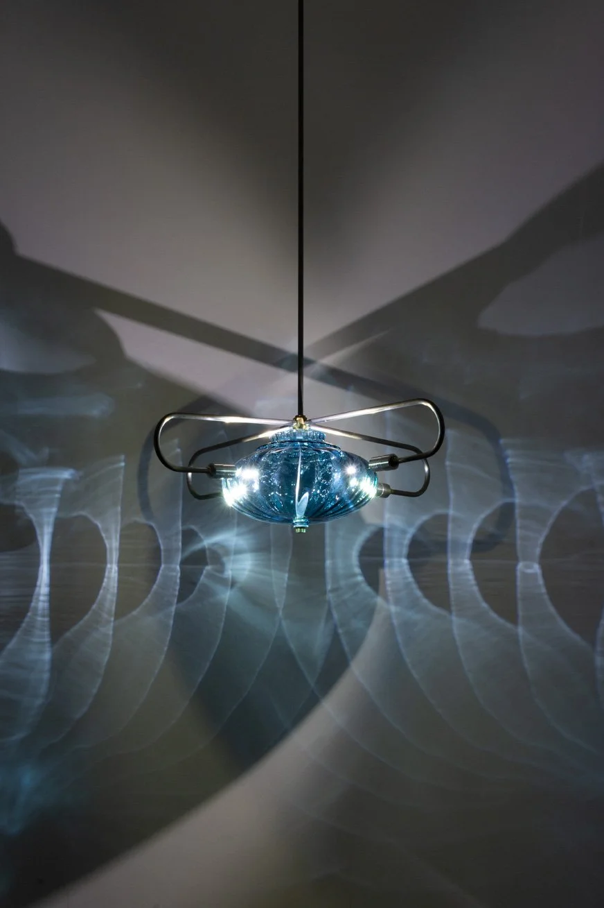 Illuminated detail shot of the lampshade, highlighting the quality of the glass that leads to a unique light cast.