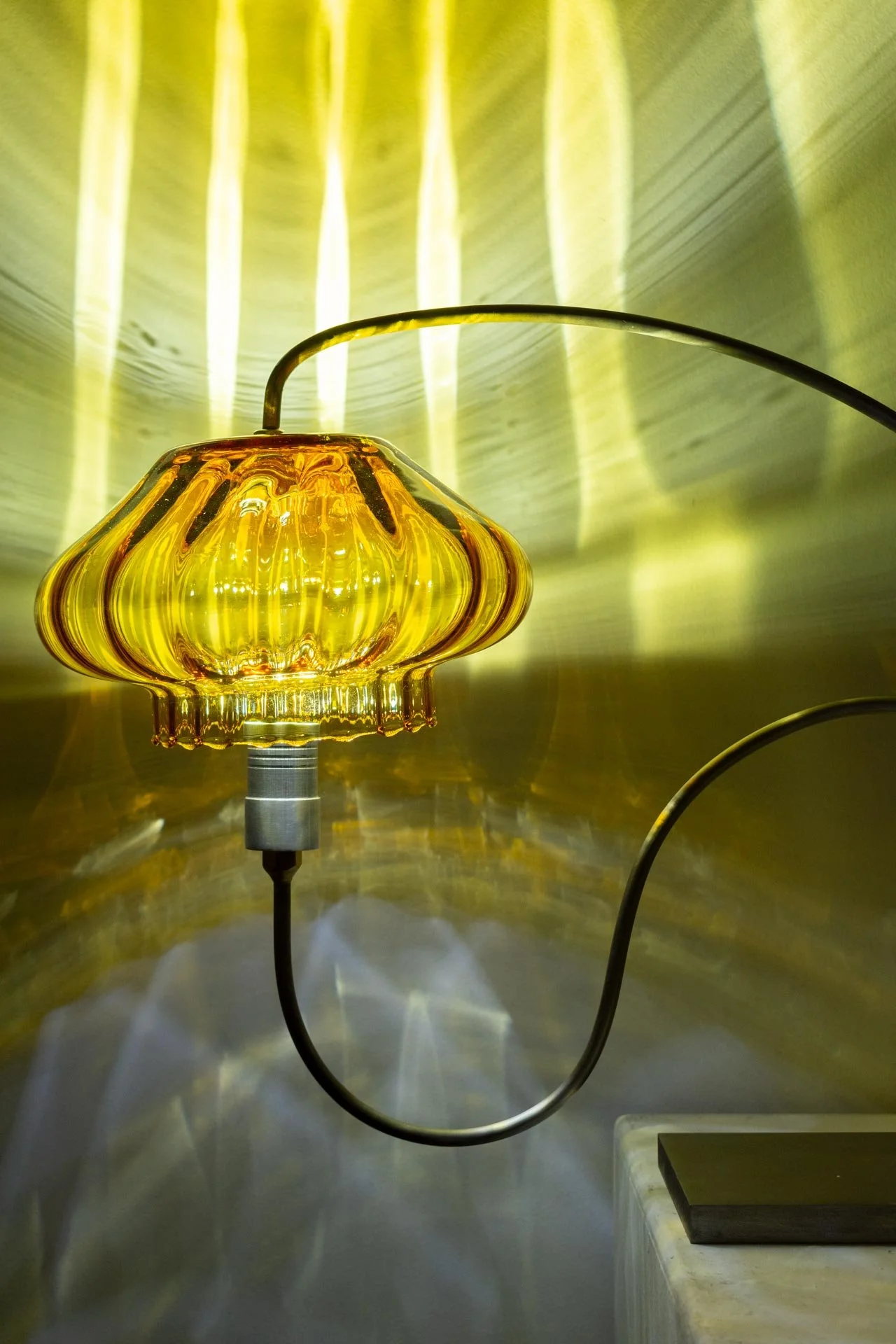 Illuminated detail shot of the jar, highlighting the quality of the glass that leads to a unique light cast.