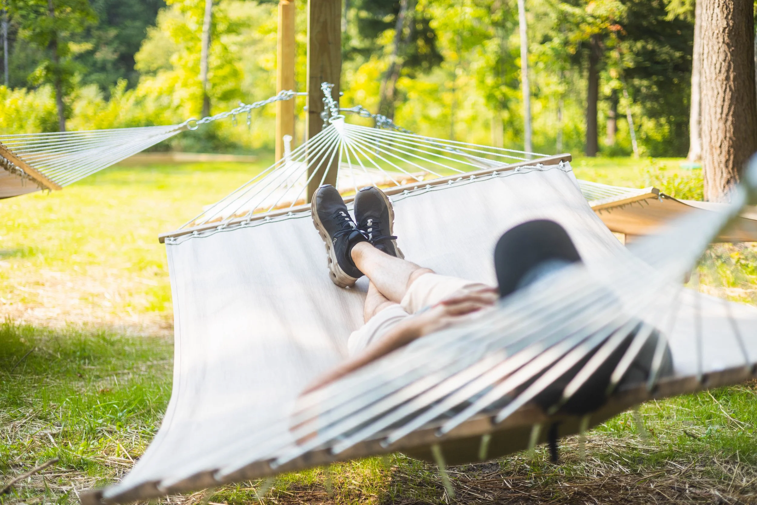 Man relaxing in hammock at Raging River Resort in Marquette Michigan