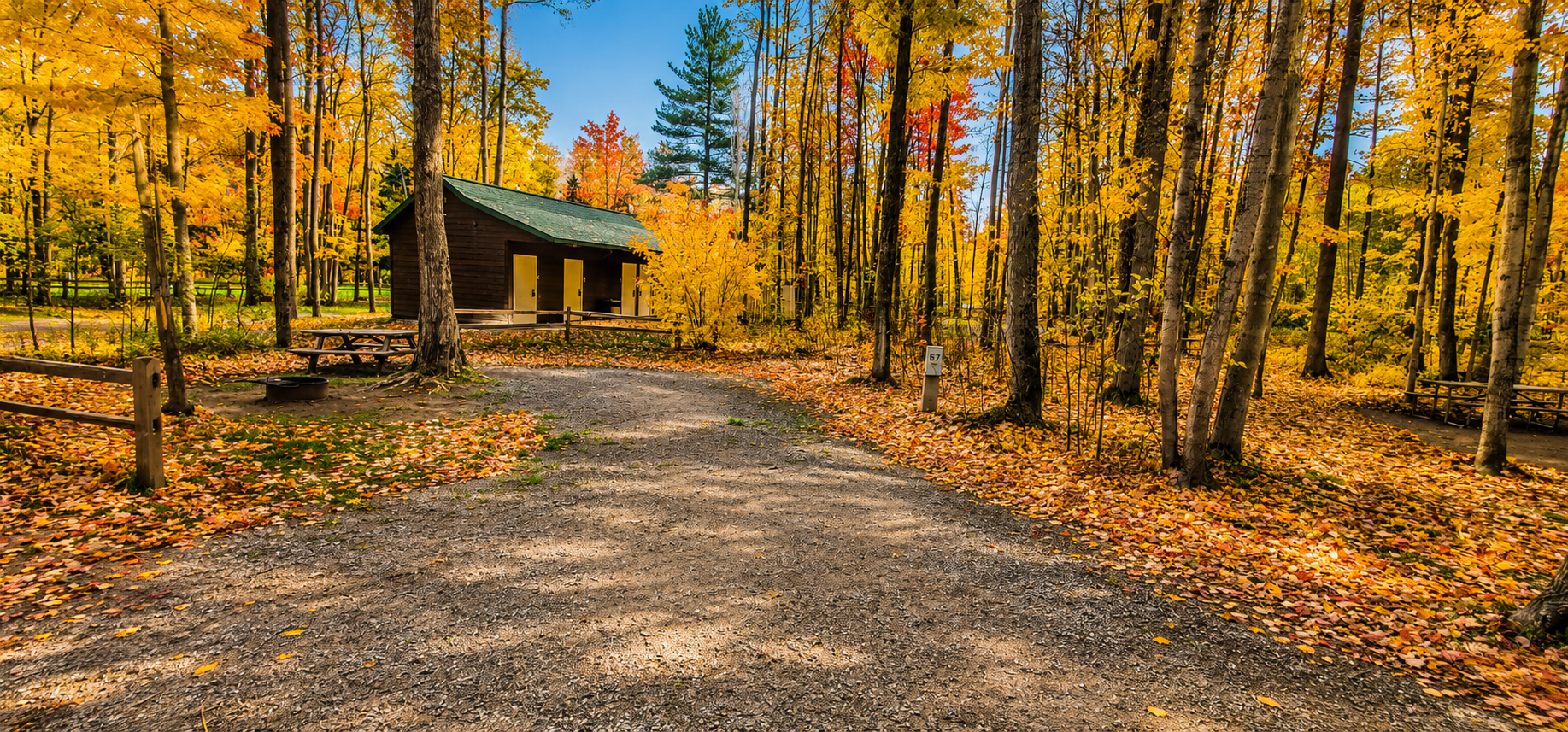 Beautiful autumn campground surrounded by colorful fall trees in Michigan's Upper Peninsula