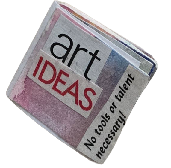 A rolled-up newspaper with the headline 'art IDEAS' and the subheading 'No tools or talent necessary!'