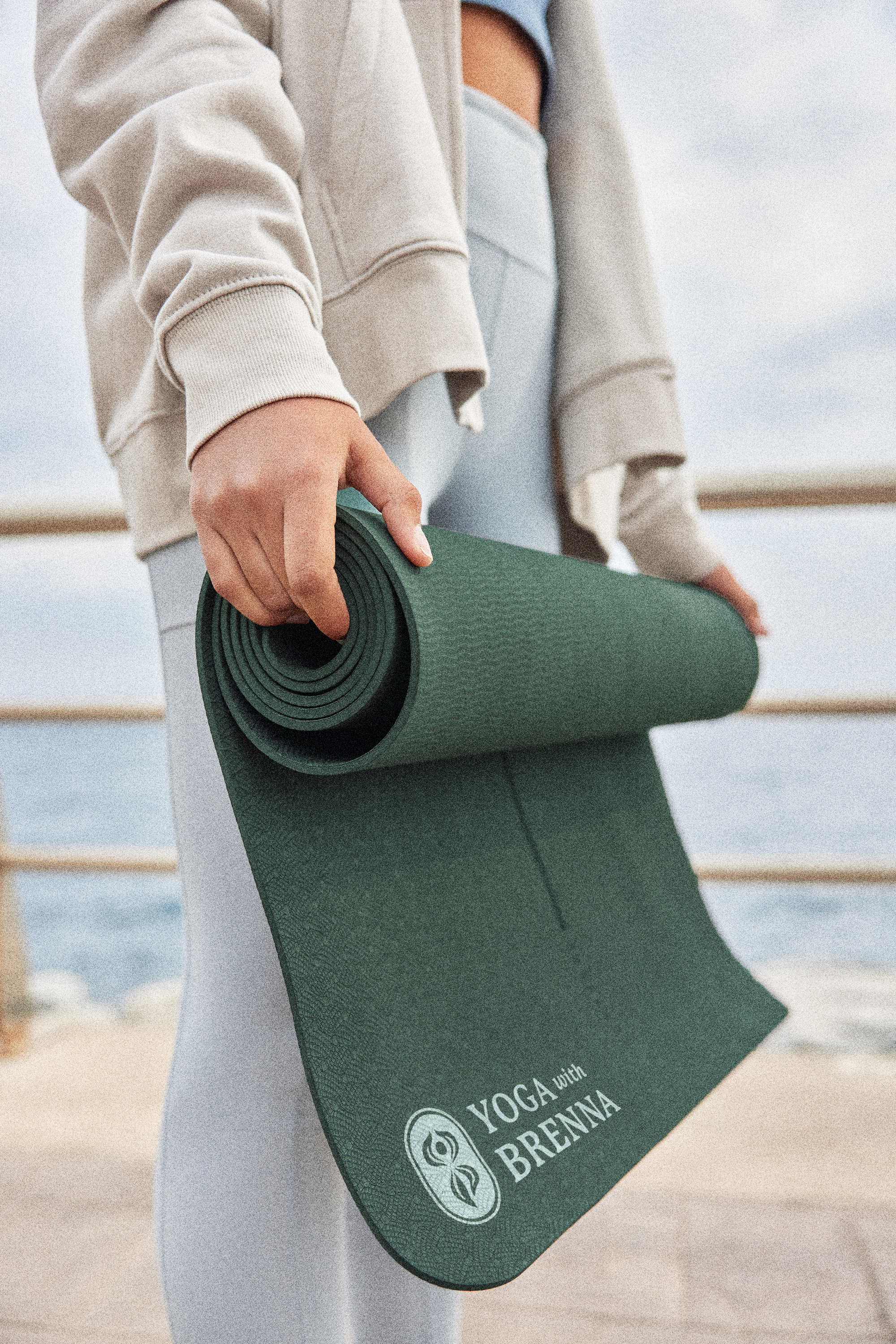 Woman_HoldingYogaMat_YogawBrenna.png