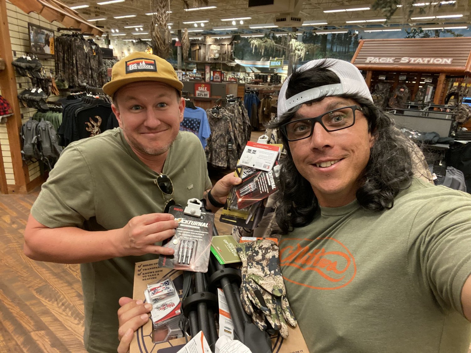 Jordan and Cory grinning with new hunting gear