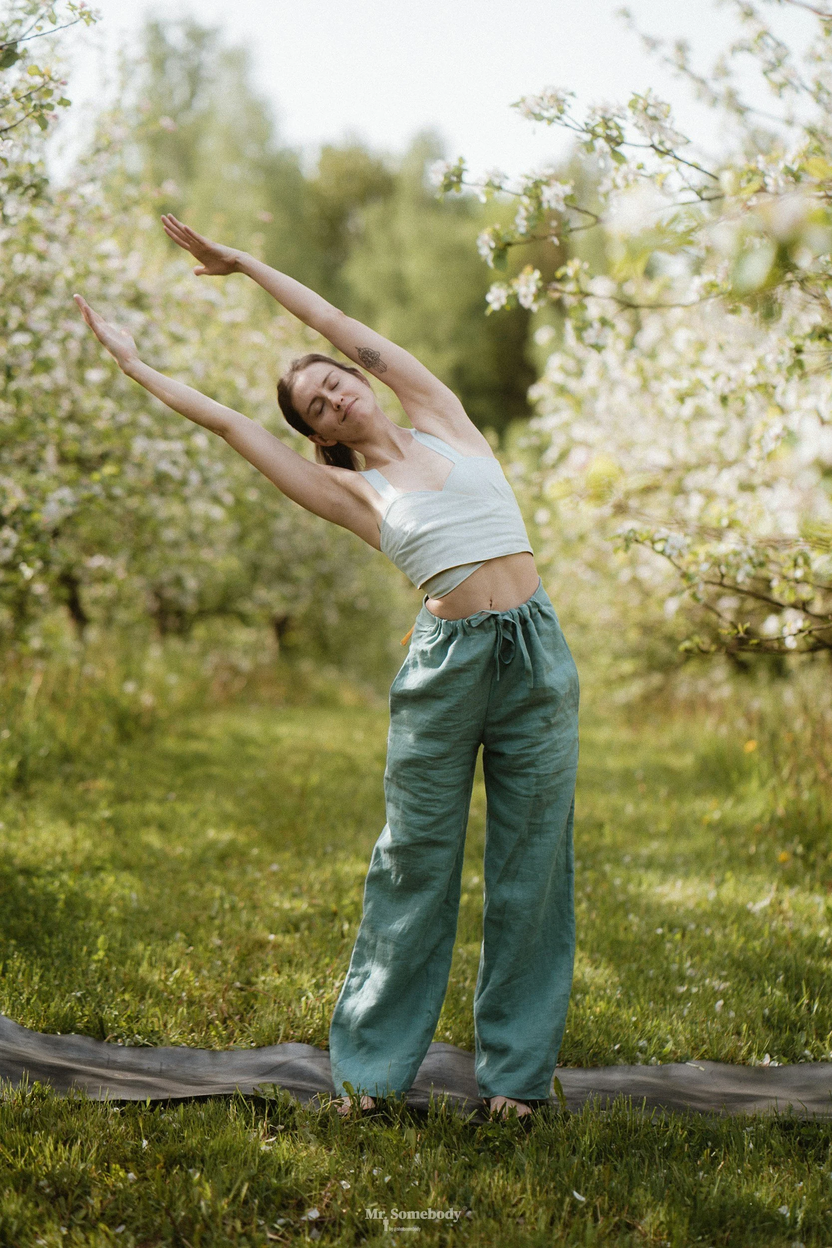 movement somatic experiencing therapy somatic interventions woman stretching in nature