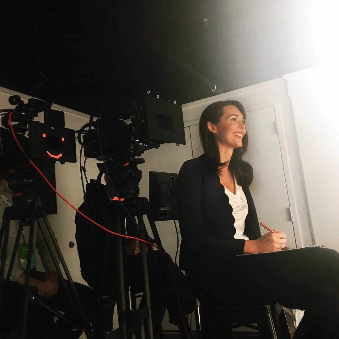 Carolyn directing leaders on-camera for the Biden Cancer Initiative