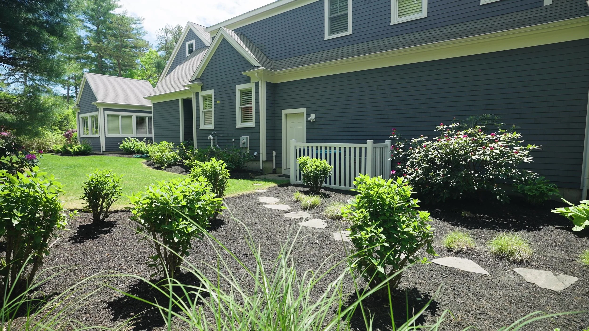 Mulching and seasonal plantings with flagstones