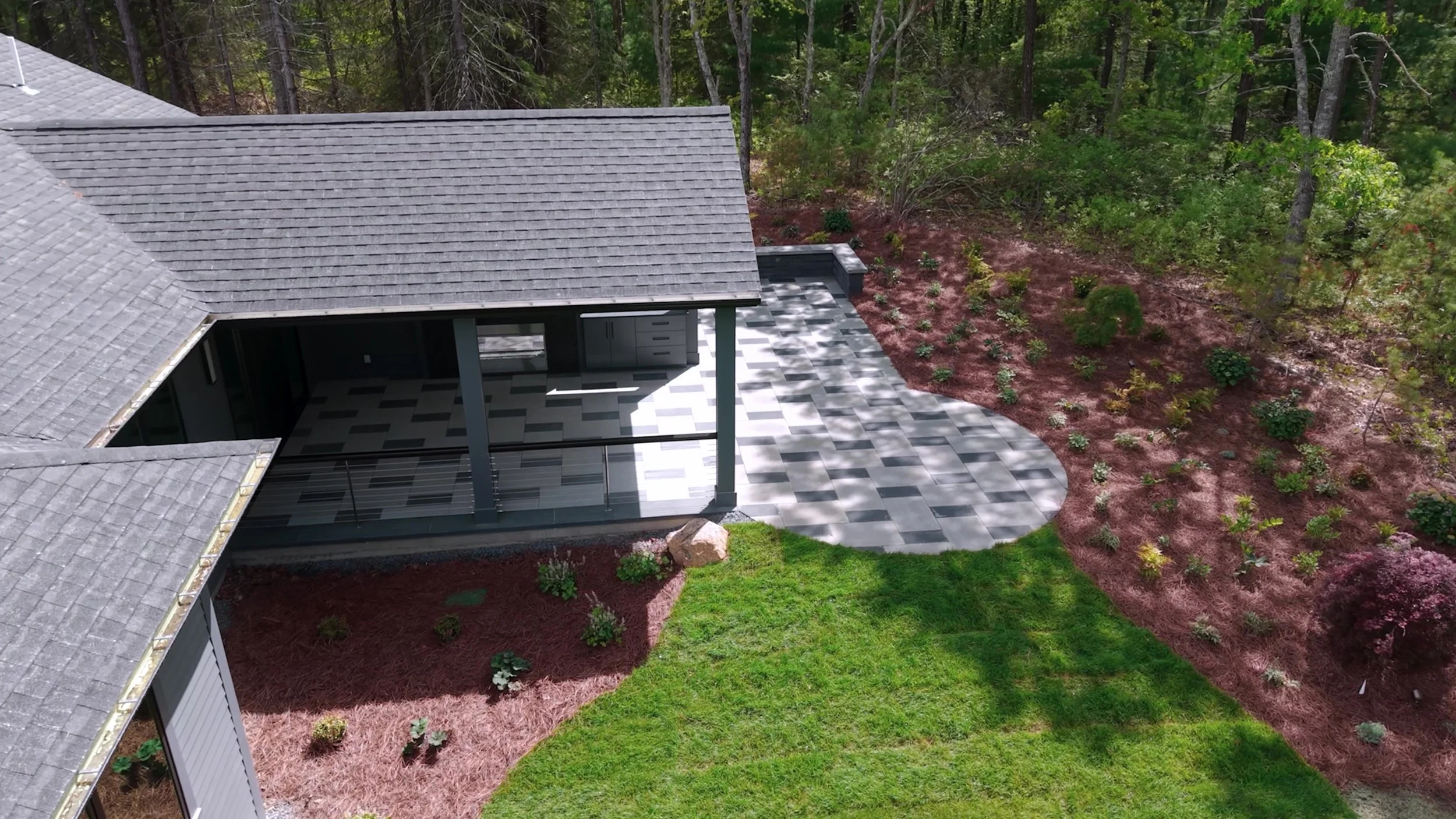 Paver patio and manicured lawn