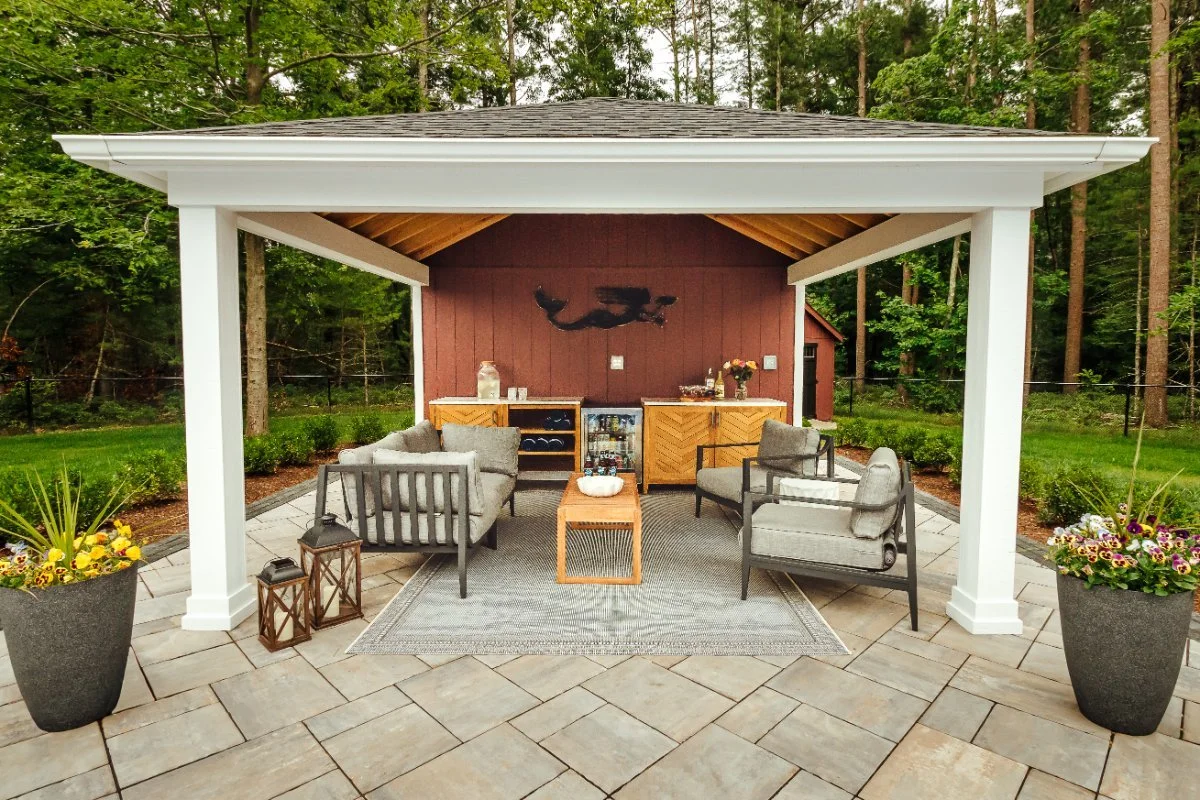 Covered cabana beside backyard pool in Eastern Massachusetts