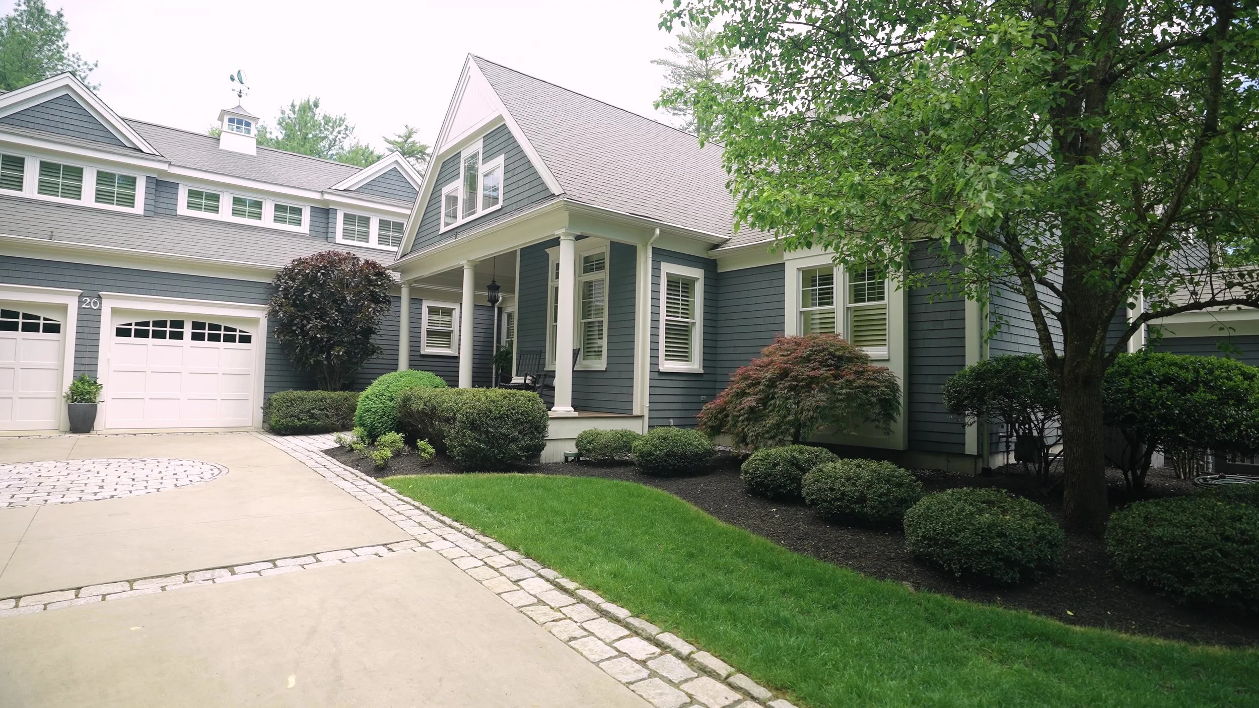 Paver driveway and plantings by Greener Horizon