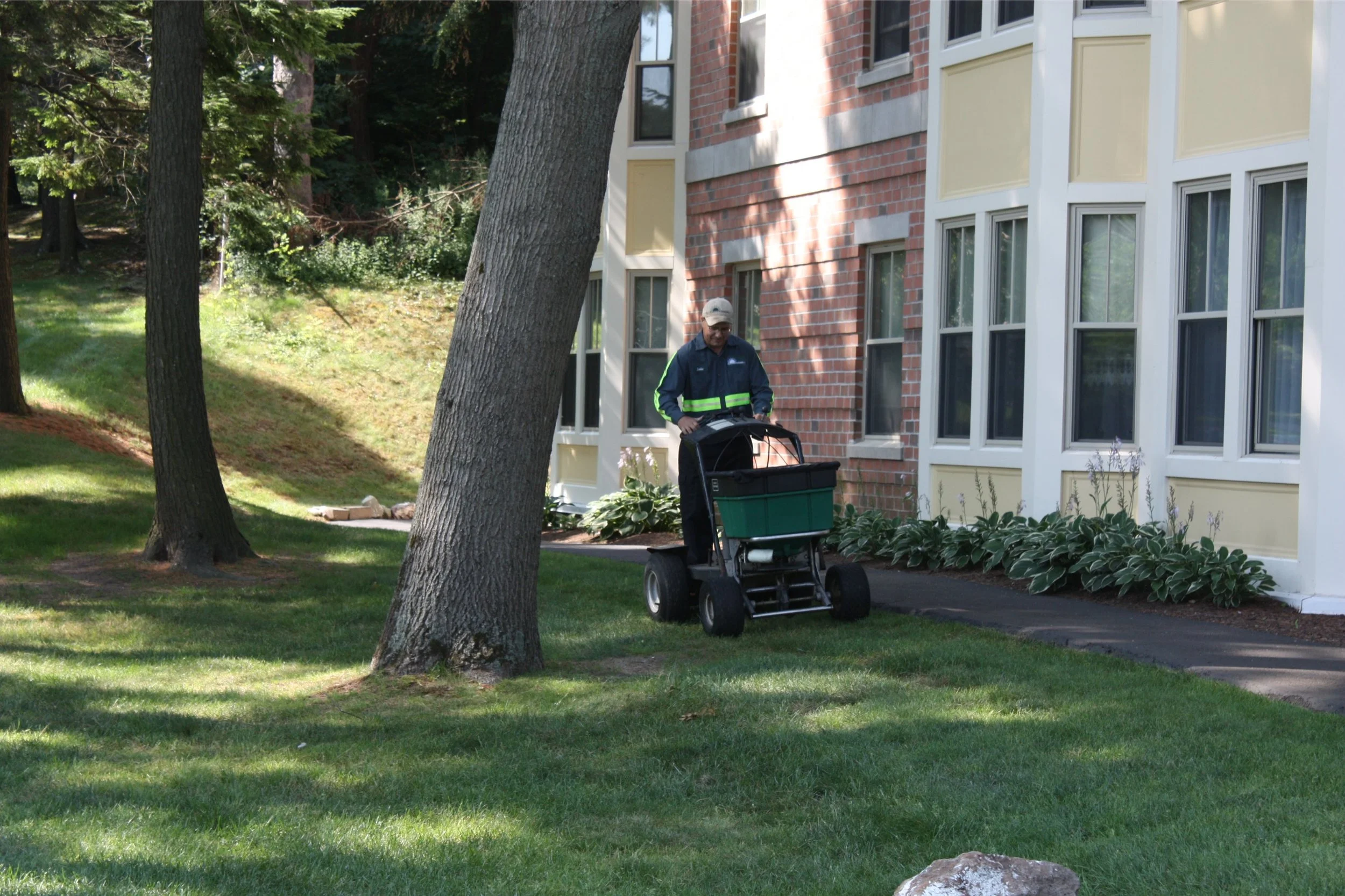 Lawn care services crew maintaining property in Hanover, MA