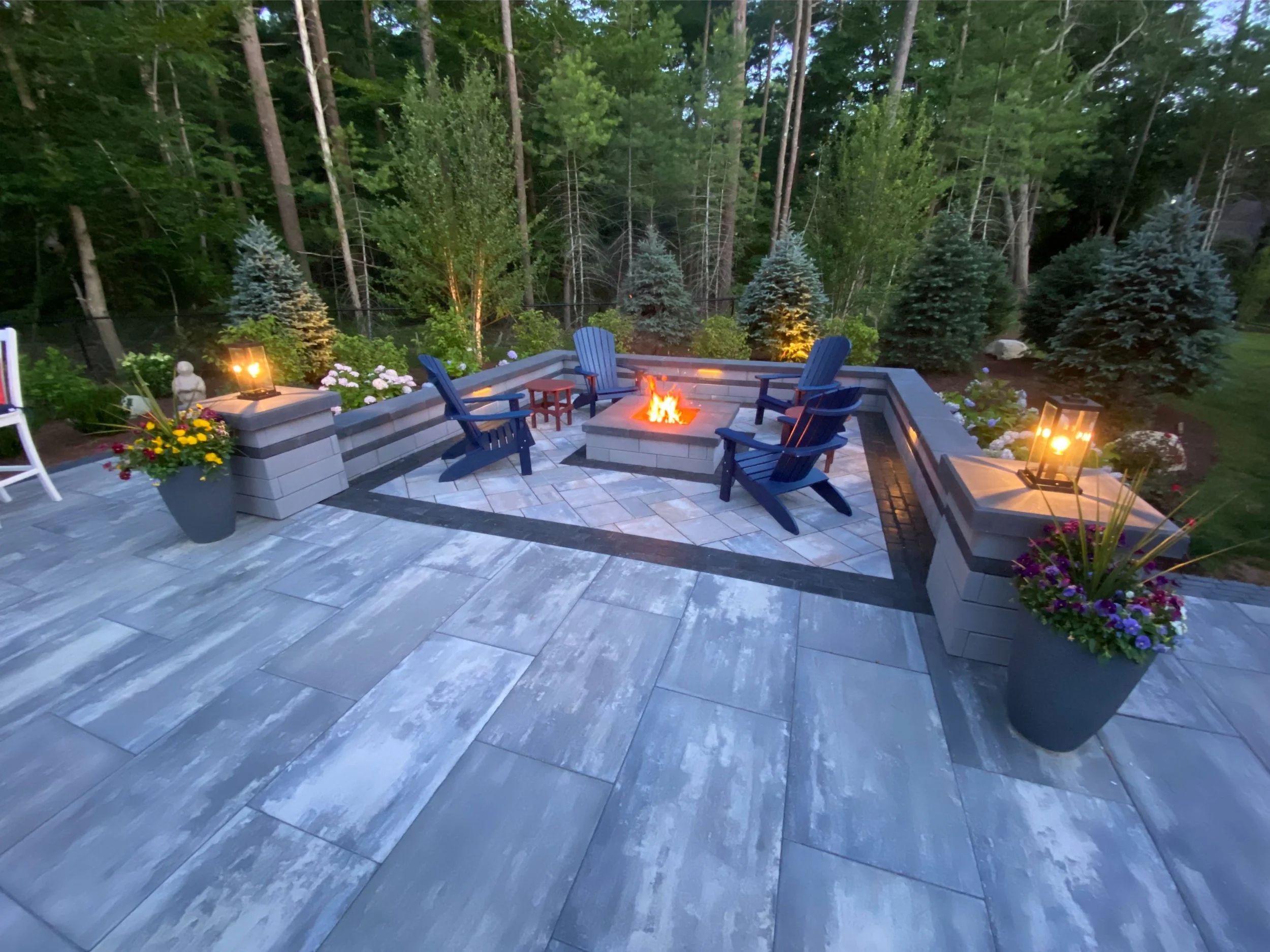 Landscaping company building fire pit area in Norwell, MA